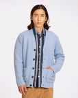 Buckley Cardigan SILVER BLUE
A classic chunky cardigan with oversized ribbing at the hem, cuffs, and on each patch pocket trim. The placket also features a smaller rib, adding a structured finish to the piece.  FAR AFIELD
