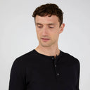 SUNSPEL Henley T-Shirt BLACK
This is the contemporary British take on the classic Henley T-shirt. Made in Sunspots ultra-light long staple Supima cotton – the same fabric as the classic T-shirts – it has a wider rib cuff and refined trocas button placket, both taken from pieces in the archive. The fit is regular.
Henley shirts were traditional English 19th century rowing shirts, reminiscent of early Sunspel shirts, given a new lease of life in the late 20th century. This is a classic understated version.
