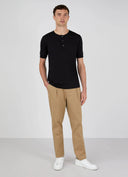 SUNSPEL Henley T-Shirt BLACK
This is the contemporary British take on the classic Henley T-shirt. Made in Sunspots ultra-light long staple Supima cotton – the same fabric as the classic T-shirts – it has a wider rib cuff and refined trocas button placket, both taken from pieces in the archive. The fit is regular.
Henley shirts were traditional English 19th century rowing shirts, reminiscent of early Sunspel shirts, given a new lease of life in the late 20th century. This is a classic understated version.