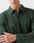 Long Sleeve Riviera Polo DARK GREEN
A long sleeve take on the Riviera polo shirt, a garment tailored for Daniel Craig for his role as James Bond in Casino Royale. Crafted from the same fine cotton mesh fabric, the polo offers a precise cut, patch pocket and full length, cuffed arms. A versatile garment that can be worn year-round.

100% Cotton
Wash at 30°C
Do not tumble dry
Dry cleanable
Designed in England and made in Portugal
 SUNSPEL